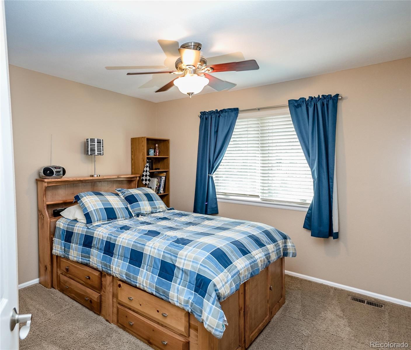 10221 South Nickolas Avenue Highlands Ranch, CO 80130 - Photo 24 of 35 a bedroom with a bed and window