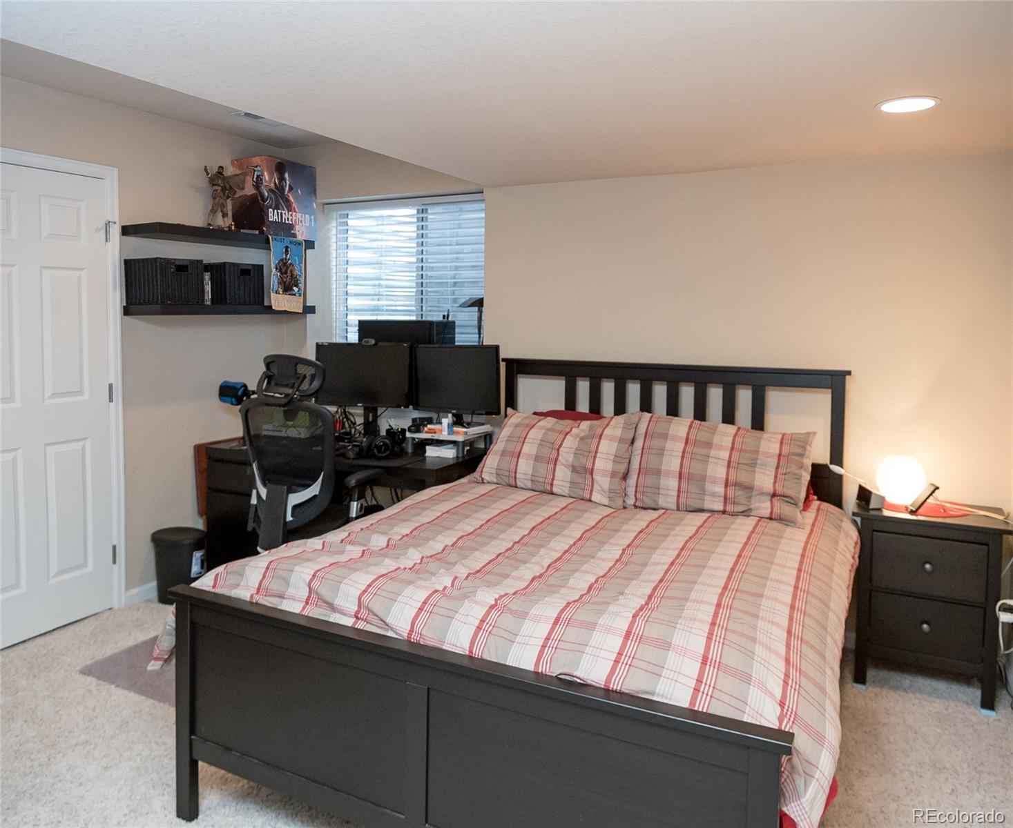 10221 South Nickolas Avenue Highlands Ranch, CO 80130 - Photo 29 of 35 a bedroom with a bed and window