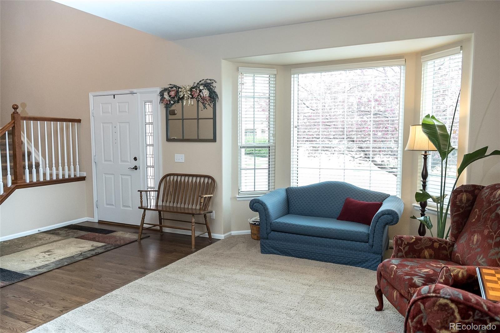 10221 South Nickolas Avenue Highlands Ranch, CO 80130 - Photo 3 of 35 a living room with furniture and a window