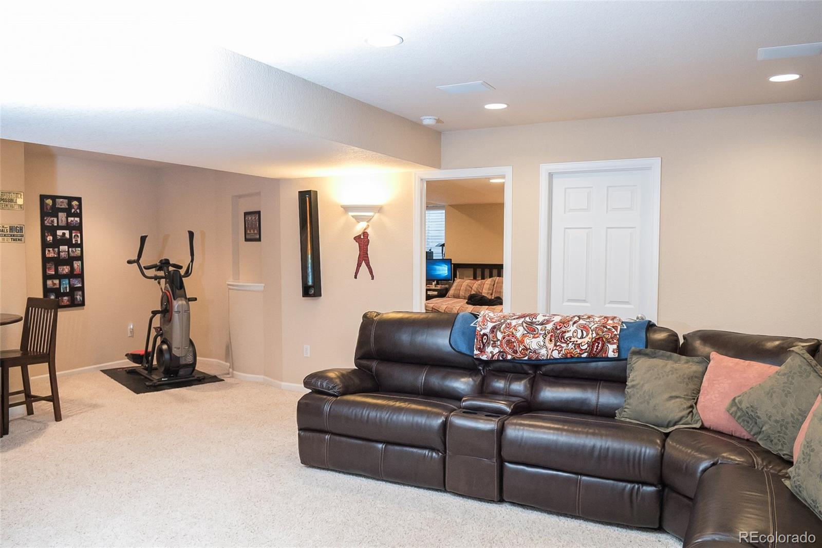 10221 South Nickolas Avenue Highlands Ranch, CO 80130 - Photo 32 of 35 a living room with furniture a air conditioner and a window