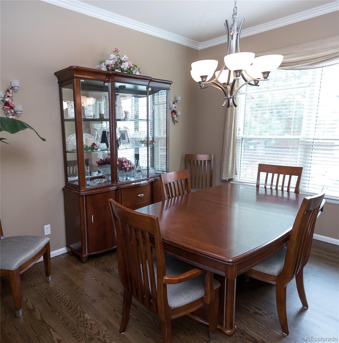 10221 South Nickolas Avenue Highlands Ranch, CO 80130 - Photo 5 of 35 a view of a dining room with furniture wooden floor and chandelier