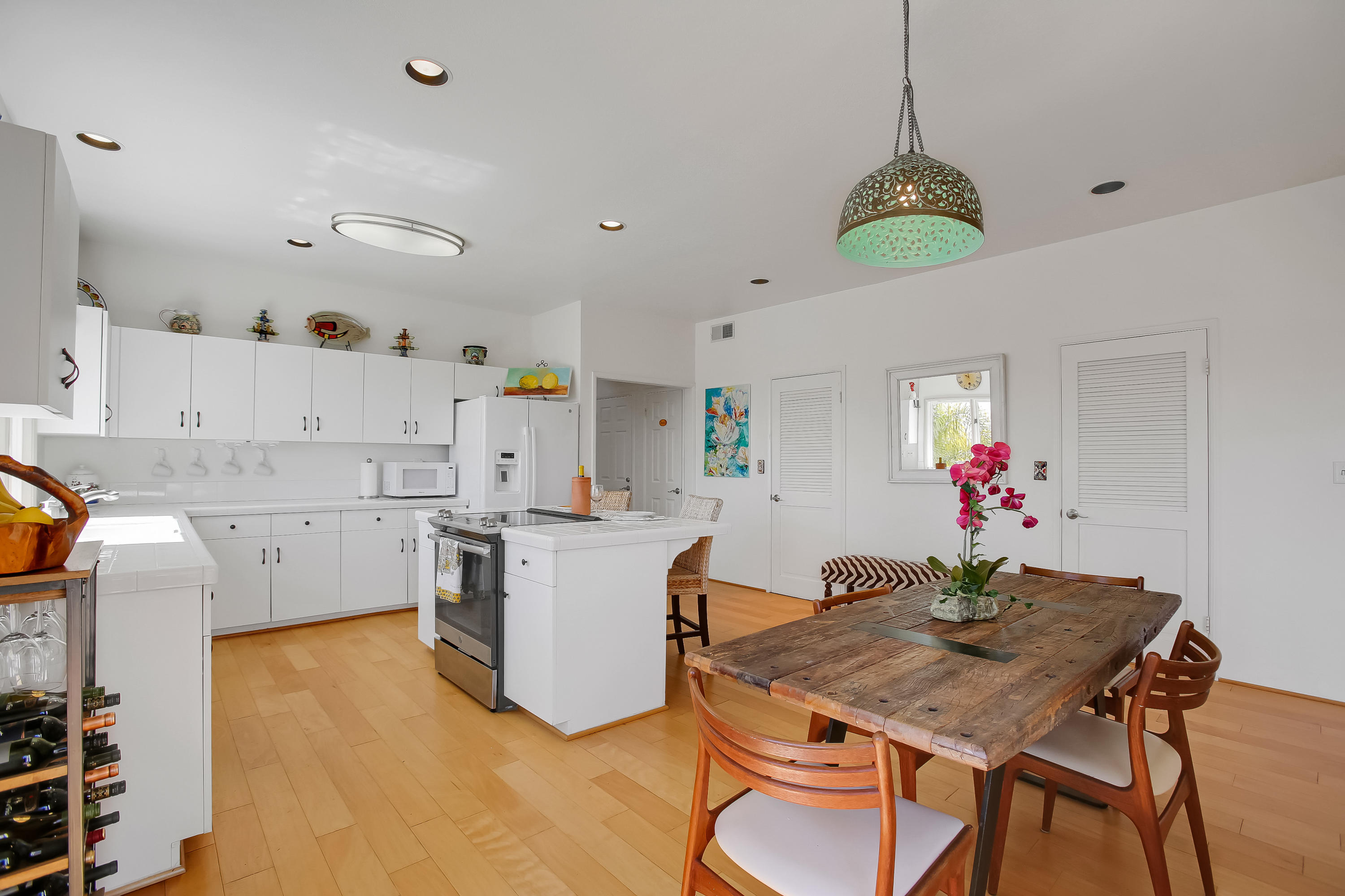 435 Fellowship Road Santa Barbara, CA 93109 - Photo 16 of 47 a view of a dining room with furniture and chandelier