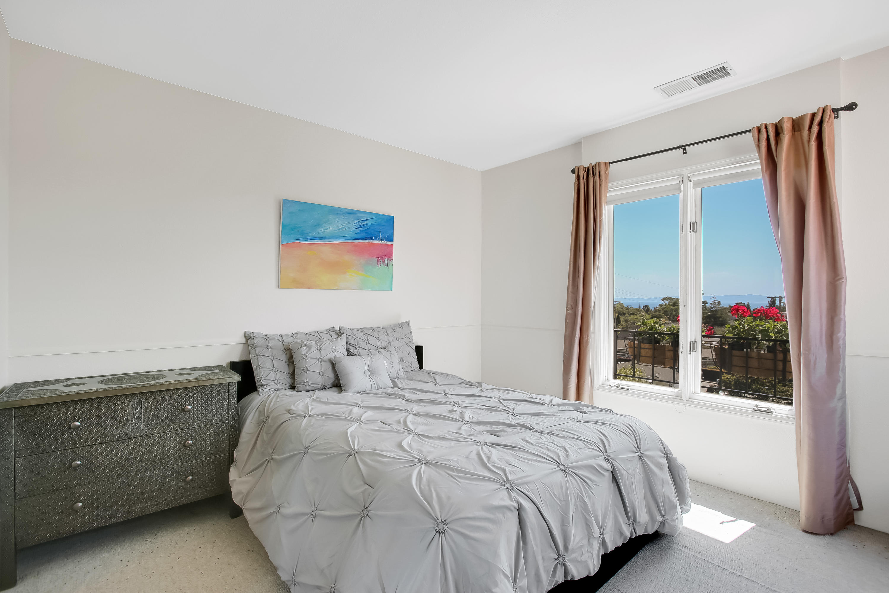 435 Fellowship Road Santa Barbara, CA 93109 - Photo 30 of 47 a bedroom with a large bed and a large window