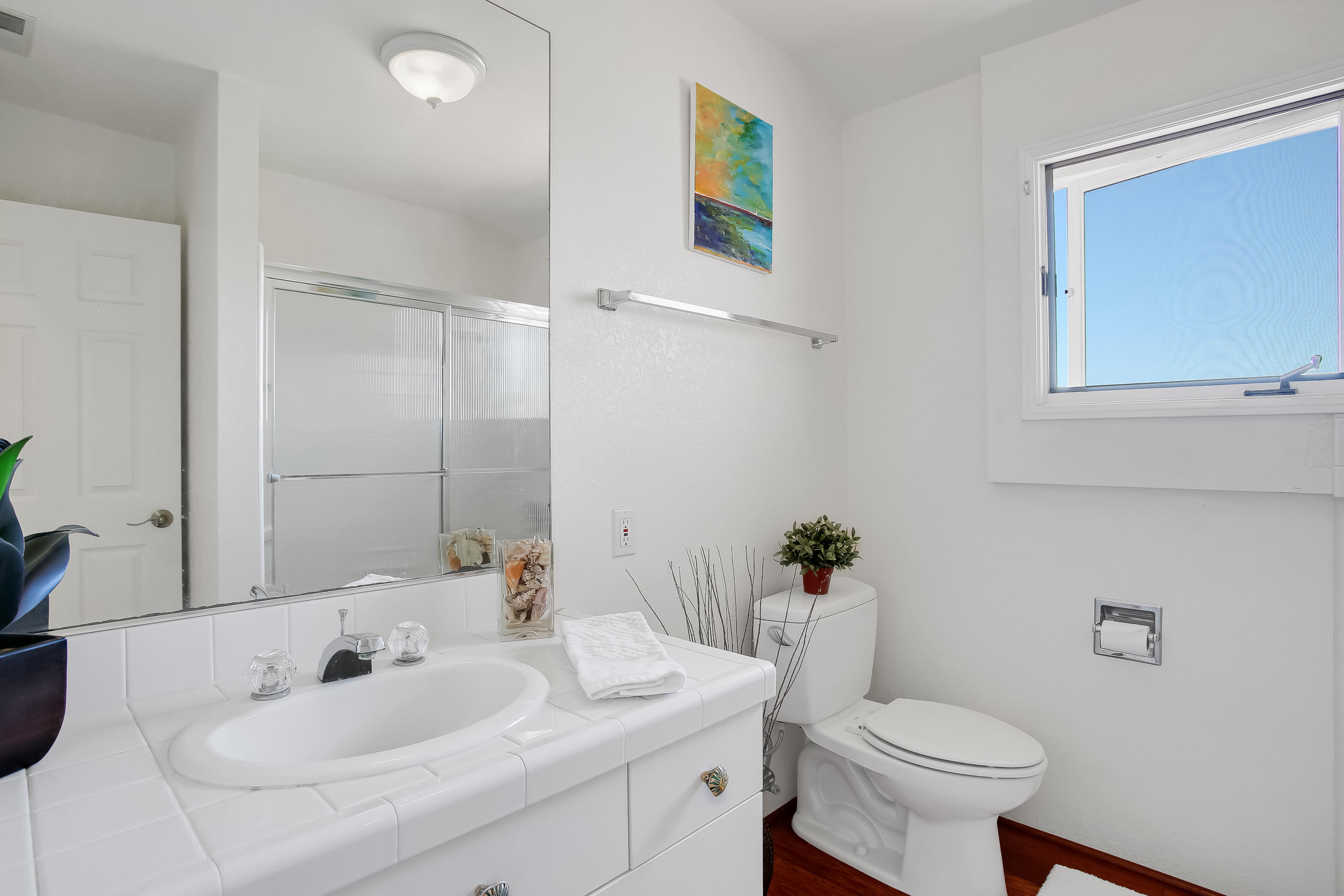 435 Fellowship Road Santa Barbara, CA 93109 - Photo 31 of 47 a bathroom with a sink toilet and a mirror