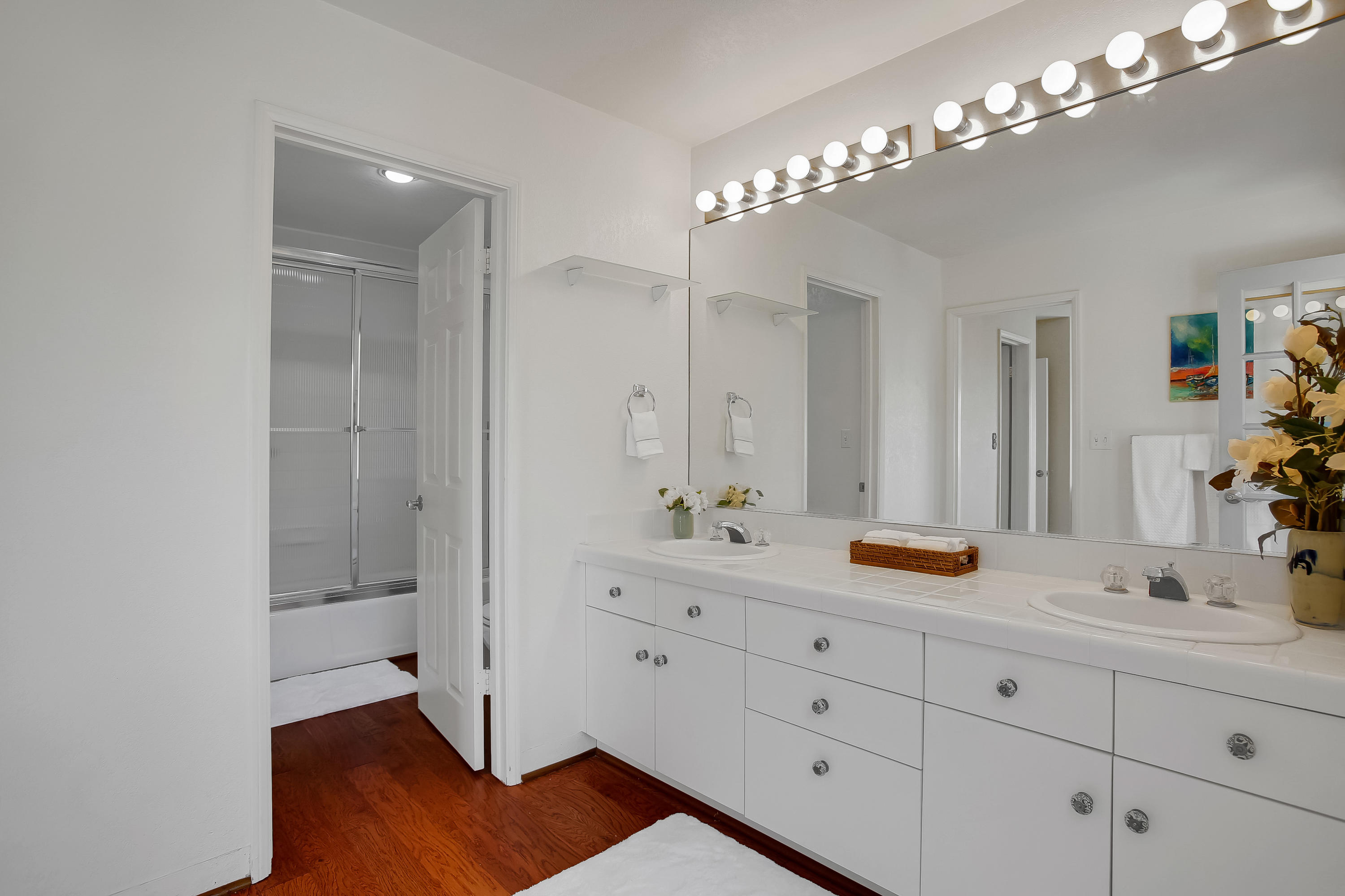 435 Fellowship Road Santa Barbara, CA 93109 - Photo 34 of 47 a bathroom with a double vanity sink and a mirror