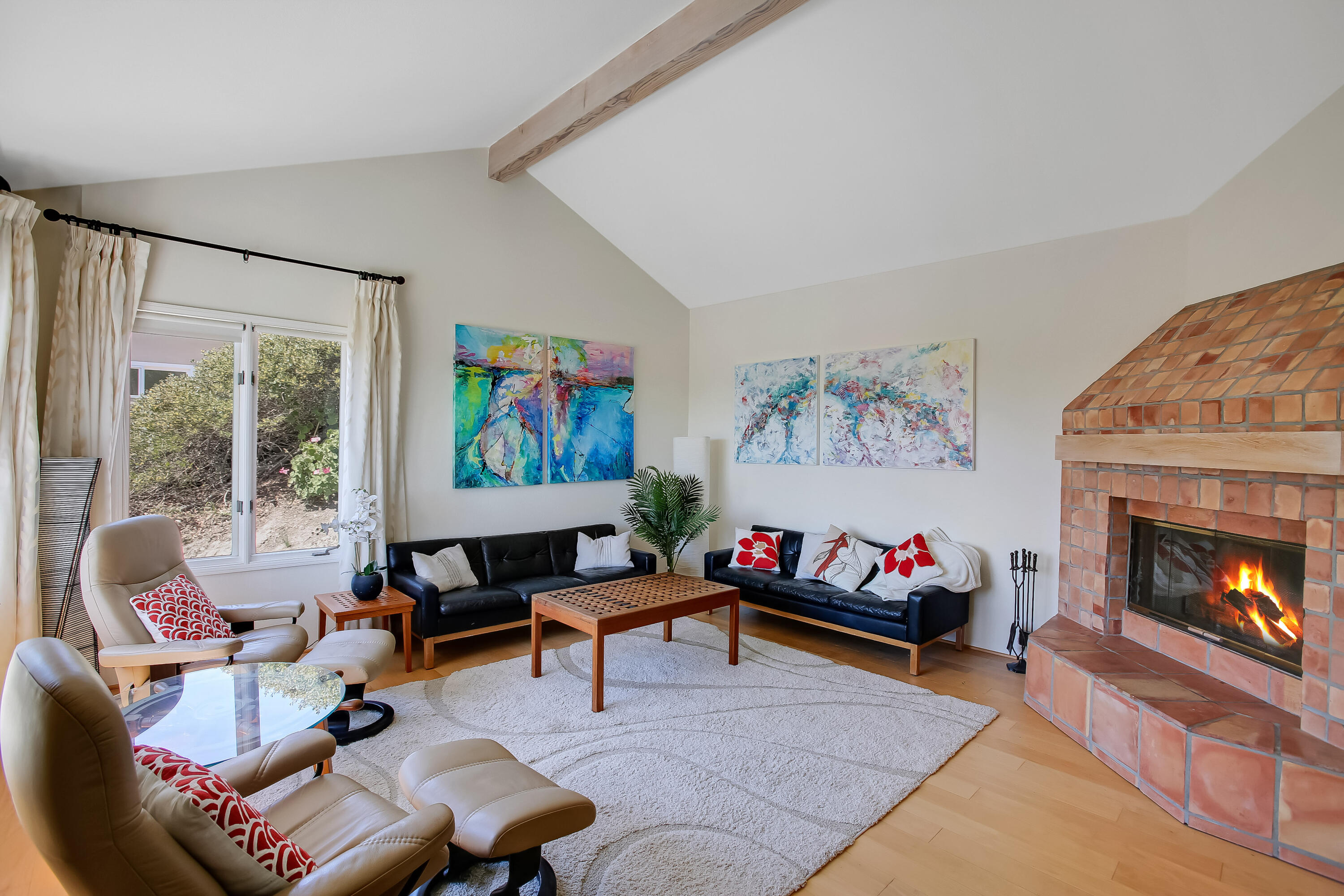 435 Fellowship Road Santa Barbara, CA 93109 - Photo 8 of 47 a living room with furniture and a fireplace