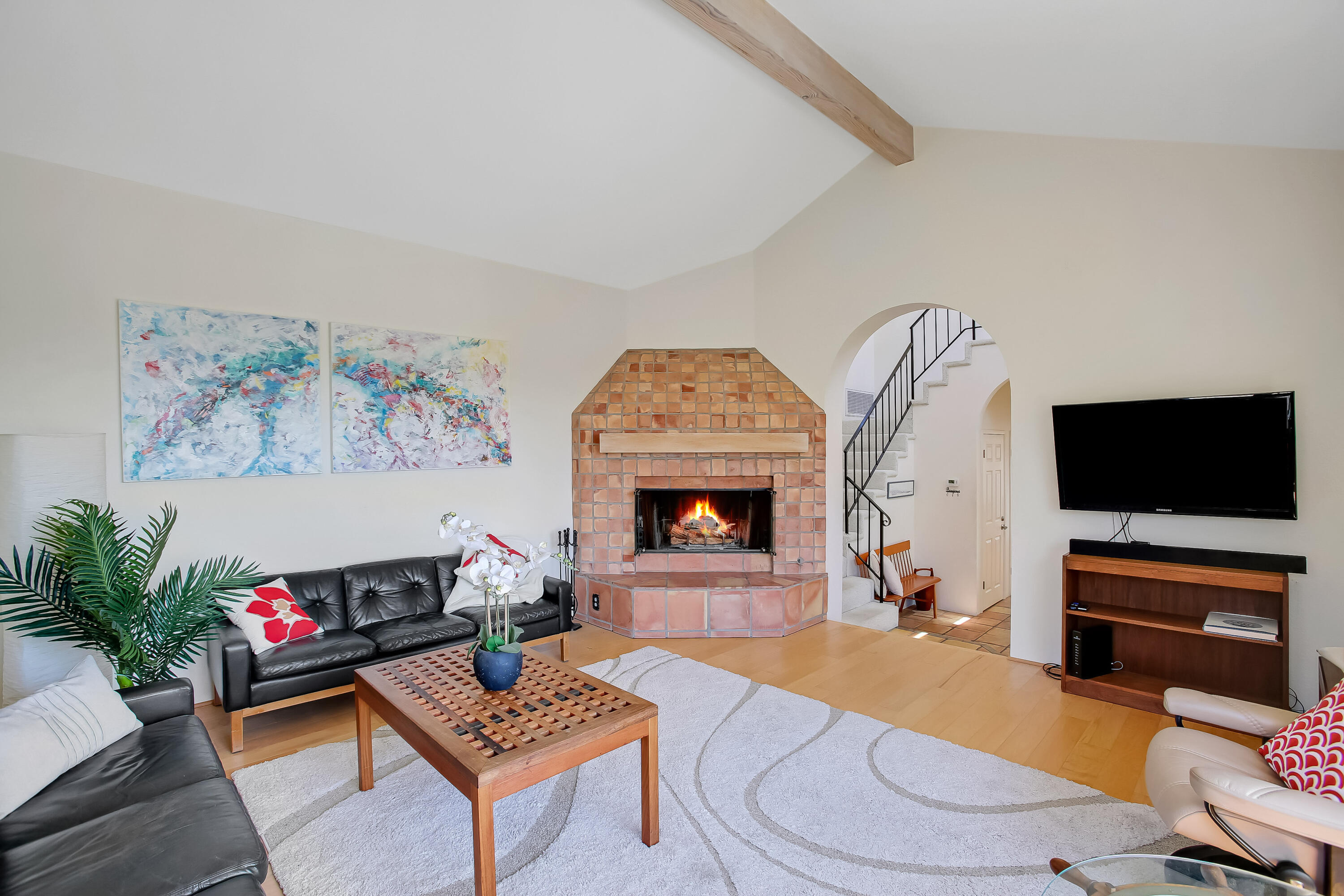 435 Fellowship Road Santa Barbara, CA 93109 - Photo 9 of 47 a living room with furniture a flat screen tv and a fireplace