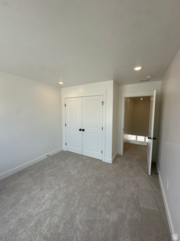 1225 West 500 South Logan, UT 84321 - Photo 25 of 39 Light gray carpet flooring extending through the room and into the doorway