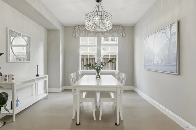 a view of a dining room with furniture window and outside view