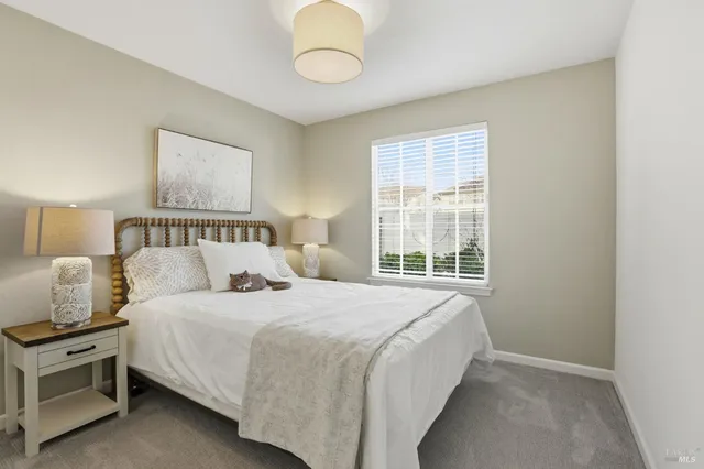 a bedroom with a bed and window