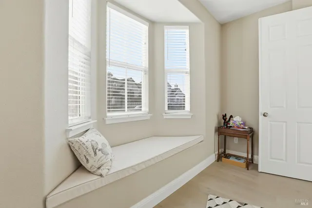 a white bath tub sitting next to a window
