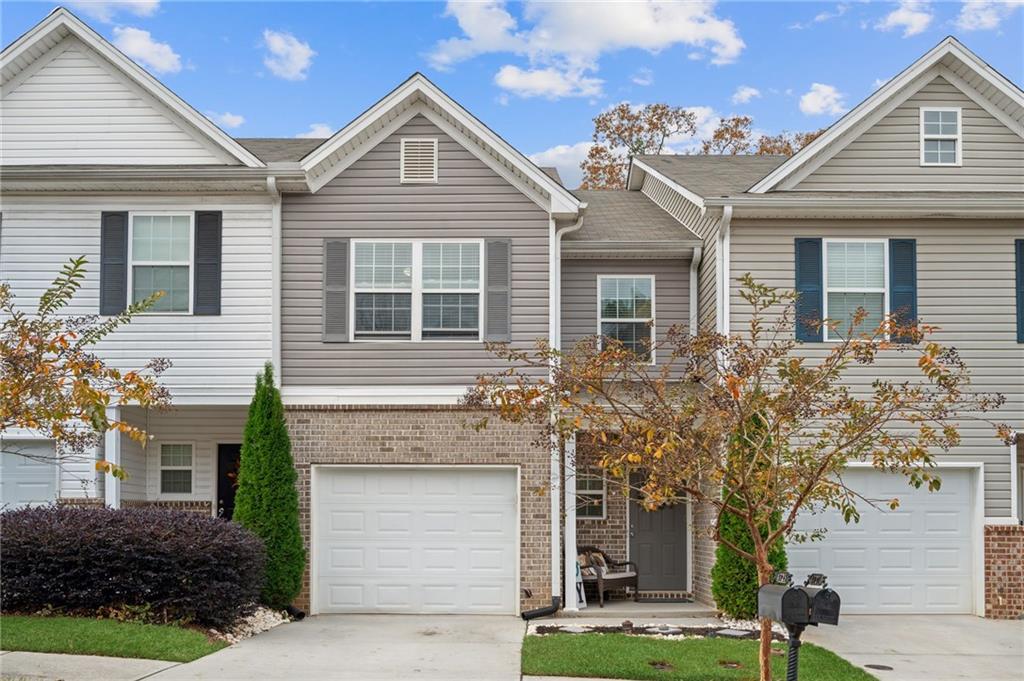 4725 Beacon Ridge Lane Flowery Branch, GA 30542 - Photo 1 of 1 View of front of house with a garage