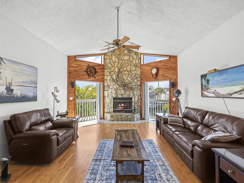 4290 Carlos Court Hernando Beach, FL 34607 - Photo 2 of 96 a living room with furniture and a fireplace
