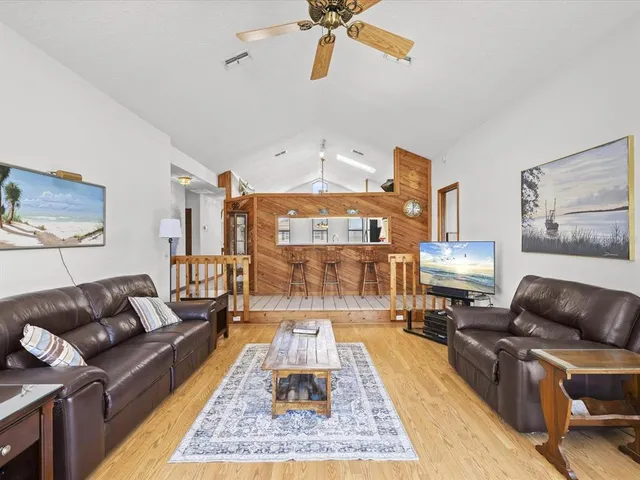 a view of a lake with boats and a bridge