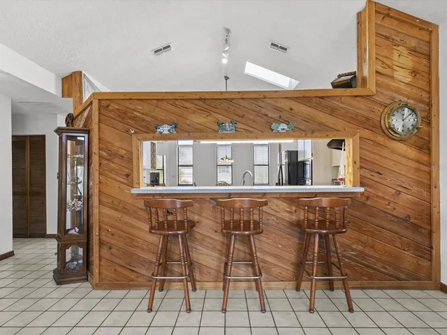 a view of empty room with wooden ceiling