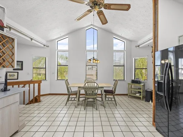 a front view of a house with a garden and plants