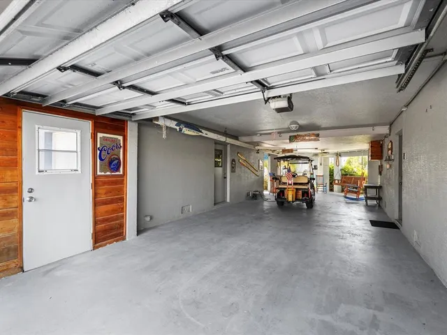 a view of a swimming pool with a patio and a lake view