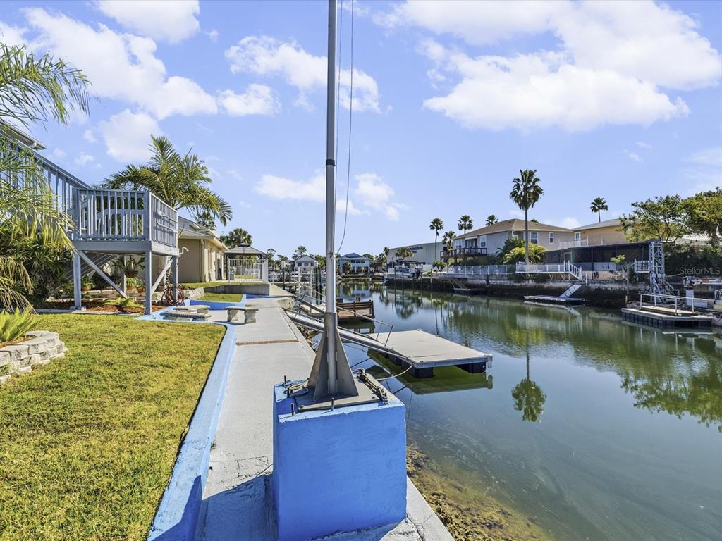 4290 Carlos Court Hernando Beach, FL 34607 - Photo 46 of 96 a view of a lake with a house