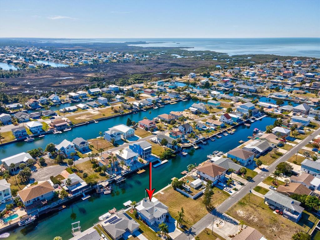 4290 Carlos Court Hernando Beach, FL 34607 - Photo 58 of 96 an aerial view of a houses with a lake view