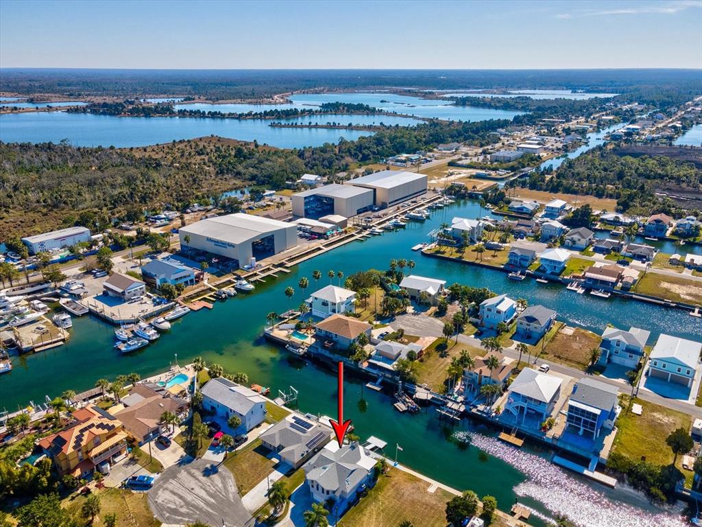 4290 Carlos Court Hernando Beach, FL 34607 - Photo 64 of 96 an aerial view of a city with lots of residential buildings ocean and mountain view in back