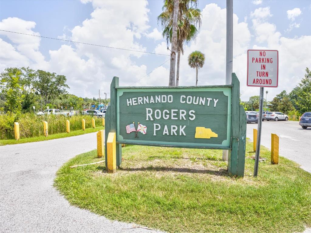 4290 Carlos Court Hernando Beach, FL 34607 - Photo 80 of 96 a sign on the side of a building