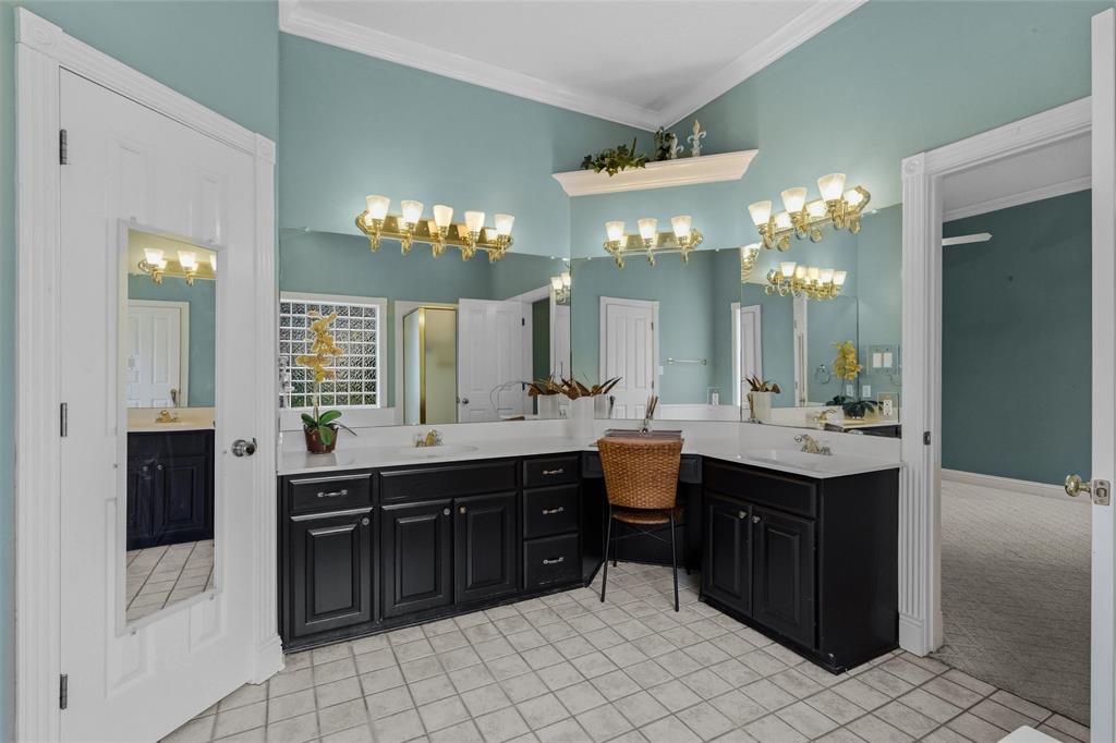 1304 Greenbriar Trail Holly Lake Ranch, TX 75765 - Photo 21 of 40 a large bathroom with a sink and a mirror