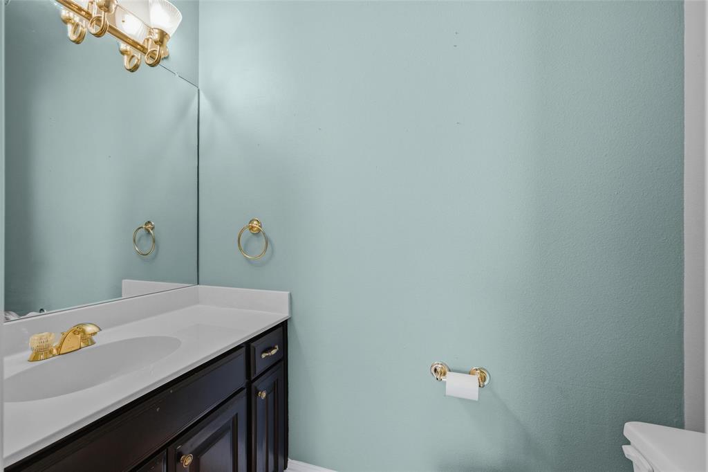 1304 Greenbriar Trail Holly Lake Ranch, TX 75765 - Photo 26 of 40 a bathroom with a sink and mirror