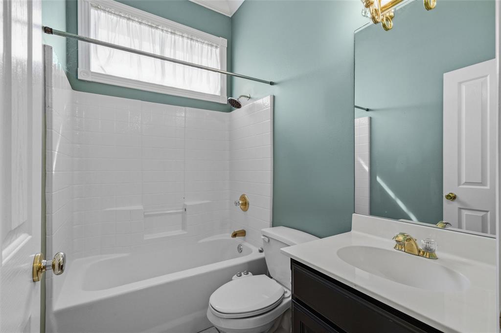 1304 Greenbriar Trail Holly Lake Ranch, TX 75765 - Photo 27 of 40 a bathroom with a sink toilet vanity and shower