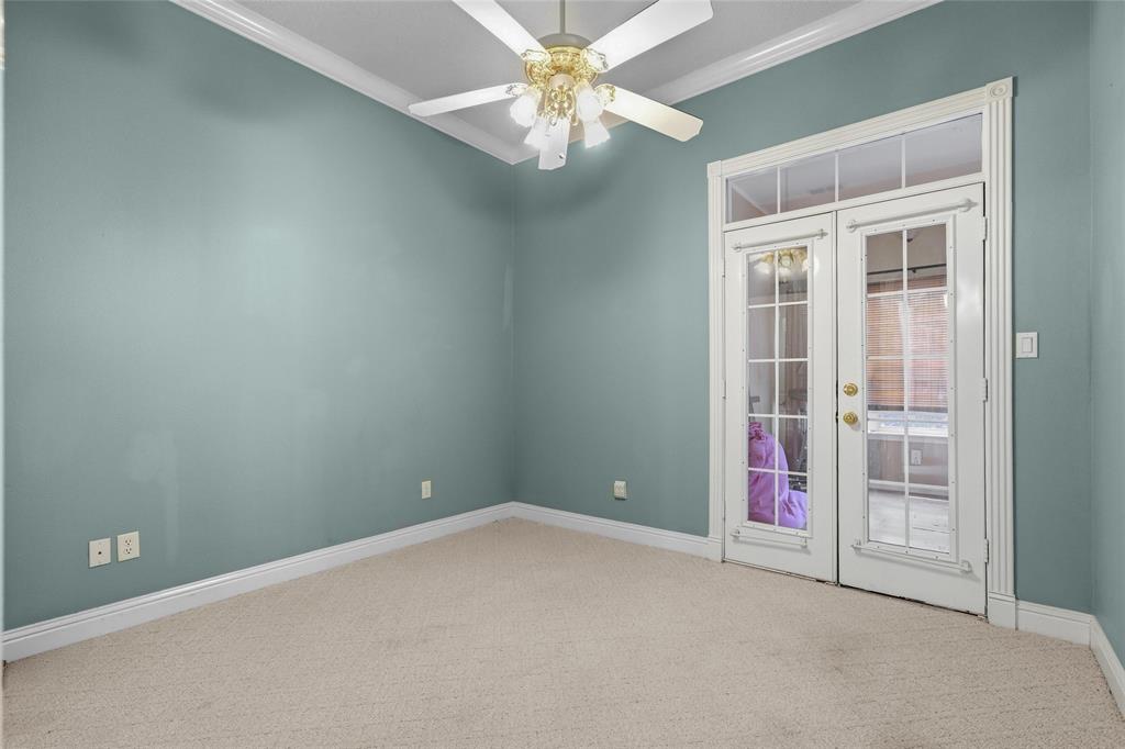 1304 Greenbriar Trail Holly Lake Ranch, TX 75765 - Photo 28 of 40 an empty room with closet and chandelier fan