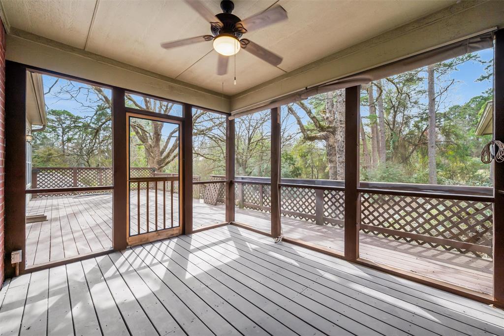 1304 Greenbriar Trail Holly Lake Ranch, TX 75765 - Photo 30 of 40 a view of a room with wooden floor and balcony