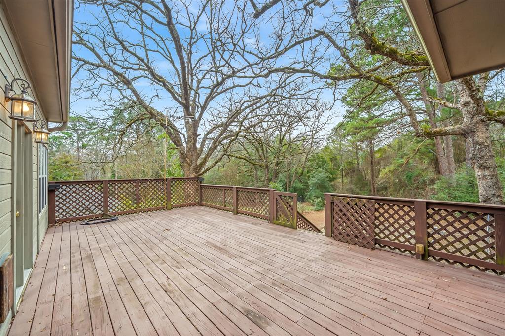 1304 Greenbriar Trail Holly Lake Ranch, TX 75765 - Photo 32 of 40 a view of a wooden deck