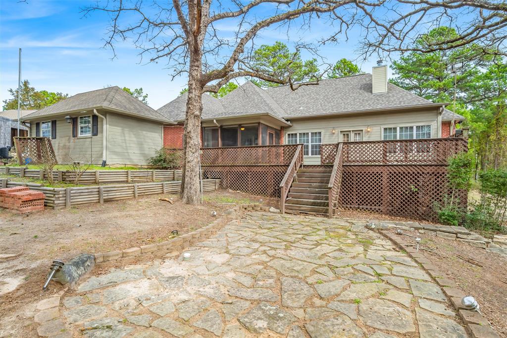 1304 Greenbriar Trail Holly Lake Ranch, TX 75765 - Photo 33 of 40 a front view of a house with a yard