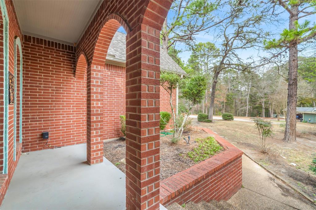 1304 Greenbriar Trail Holly Lake Ranch, TX 75765 - Photo 4 of 40 a view of house with yard