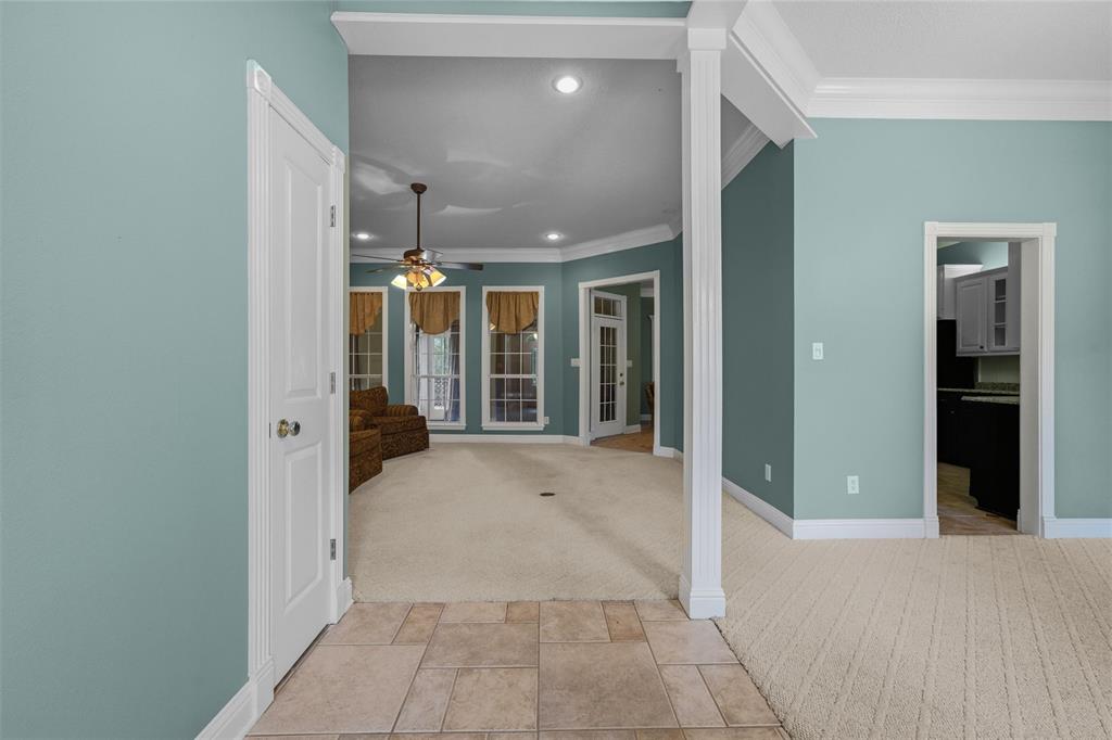 1304 Greenbriar Trail Holly Lake Ranch, TX 75765 - Photo 5 of 40 a view of a hallway with wooden shelves