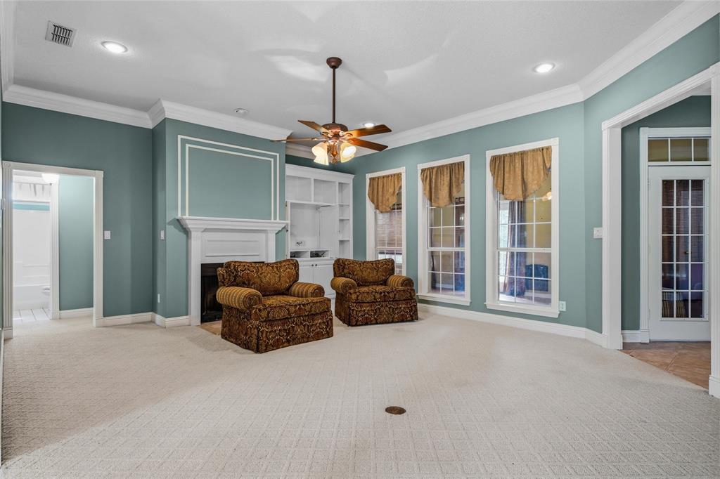 1304 Greenbriar Trail Holly Lake Ranch, TX 75765 - Photo 8 of 40 a bedroom with furniture and a chandelier