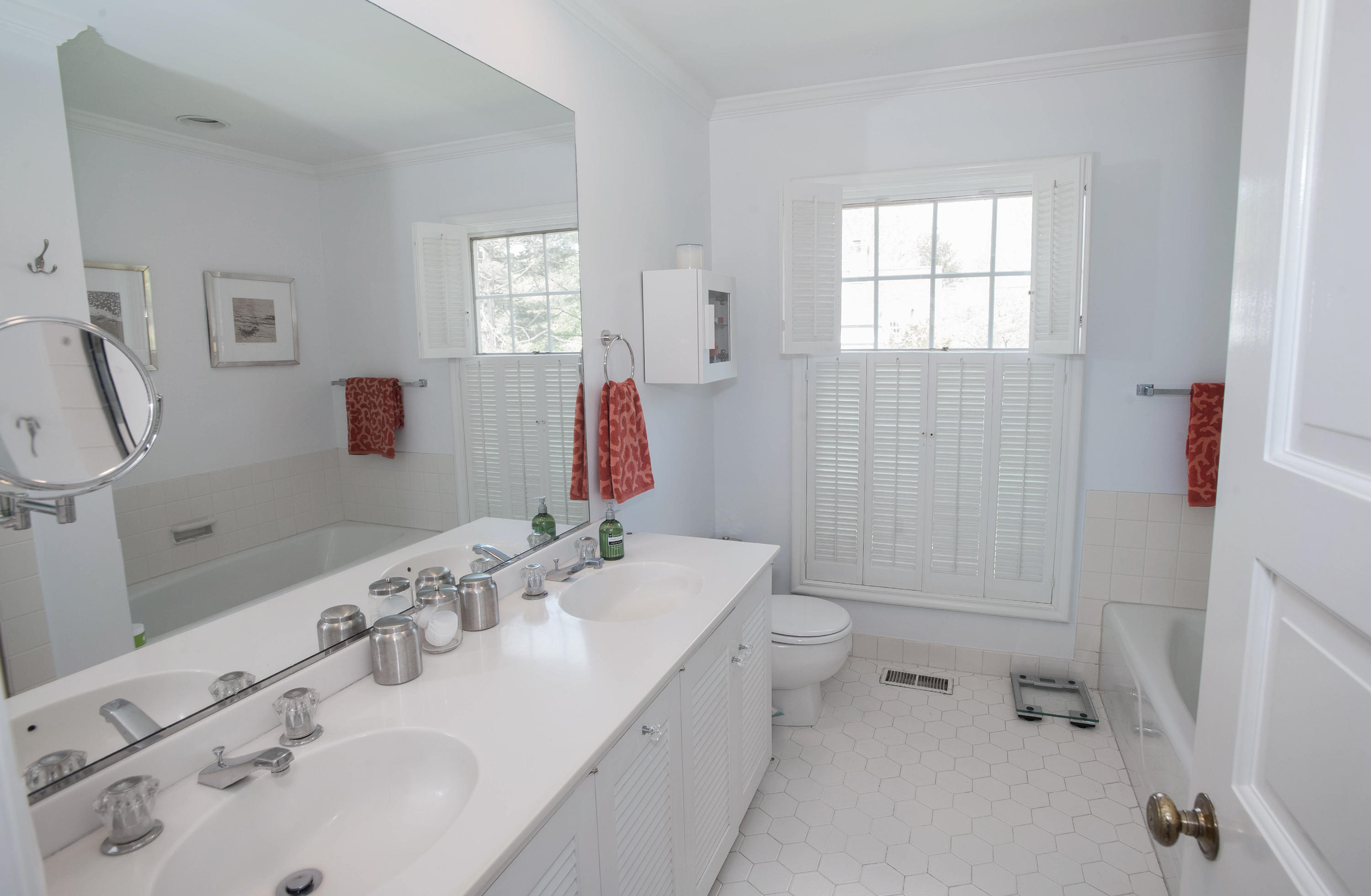141 Oenoke Ridge New Canaan, CT 06840 - Photo 15 of 18 a bathroom with a tub sink and mirror
