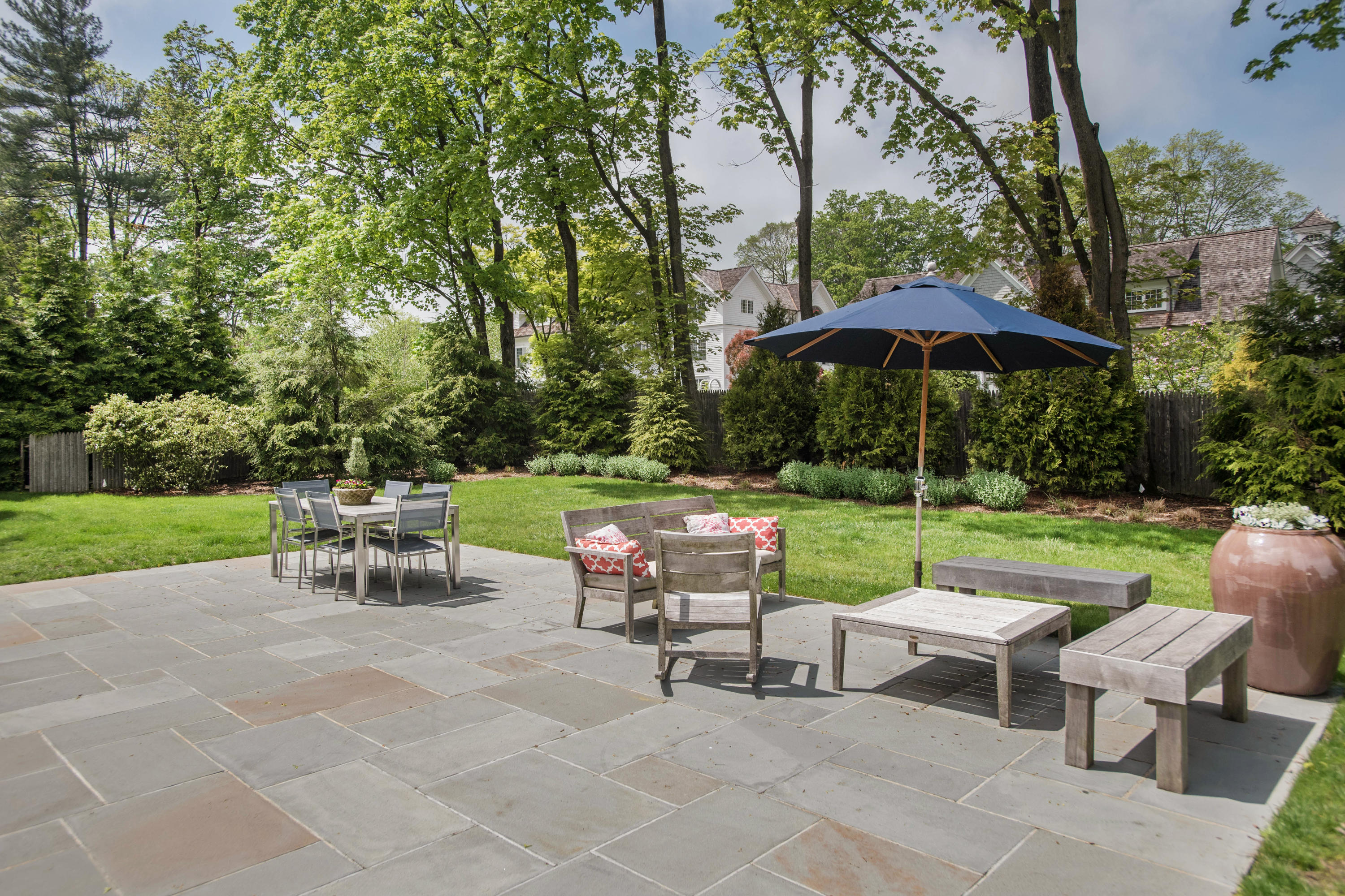 141 Oenoke Ridge New Canaan, CT 06840 - Photo 17 of 18 a view of backyard with seating area and green space