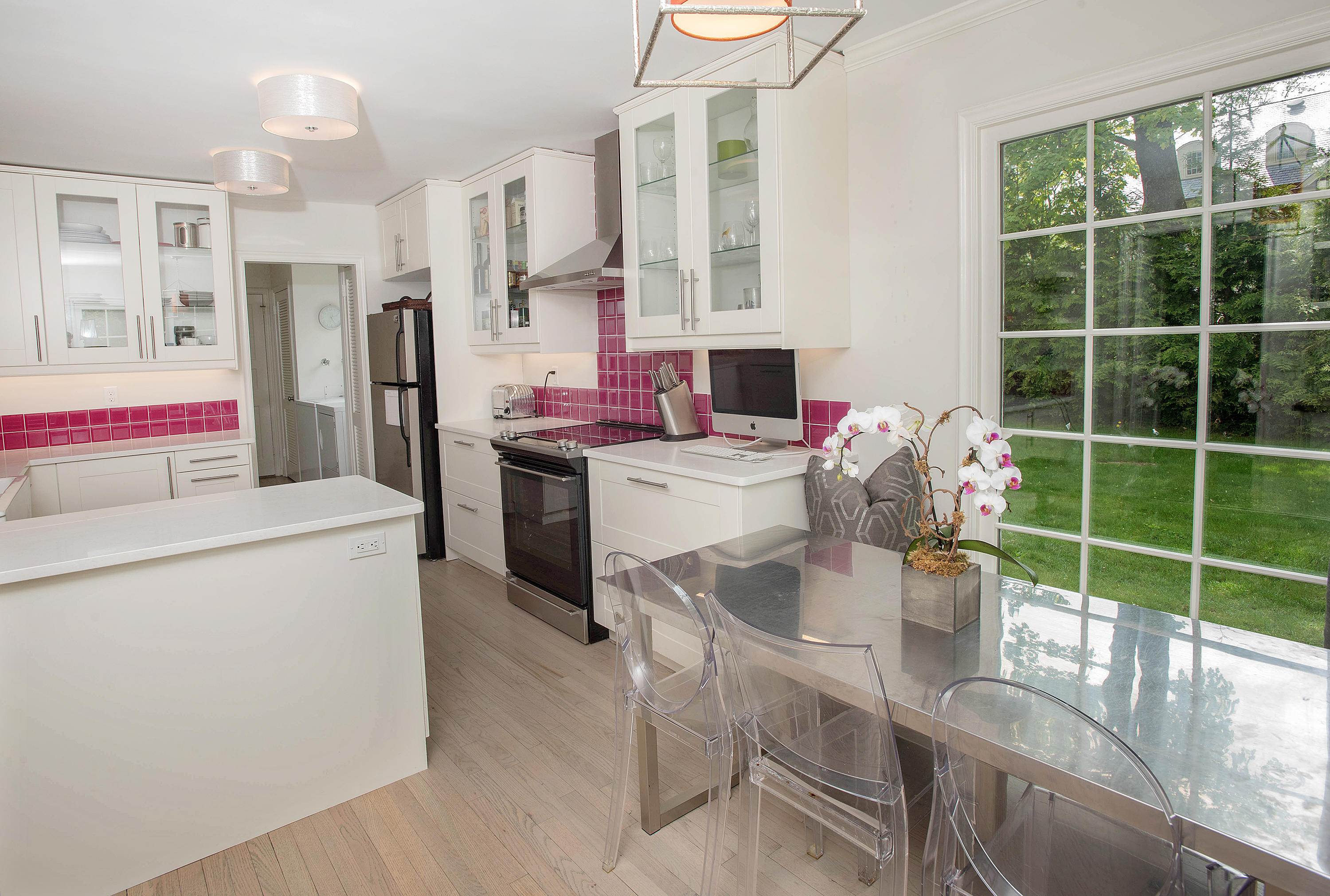 141 Oenoke Ridge New Canaan, CT 06840 - Photo 8 of 18 a kitchen with stainless steel appliances a stove refrigerator sink and cabinets