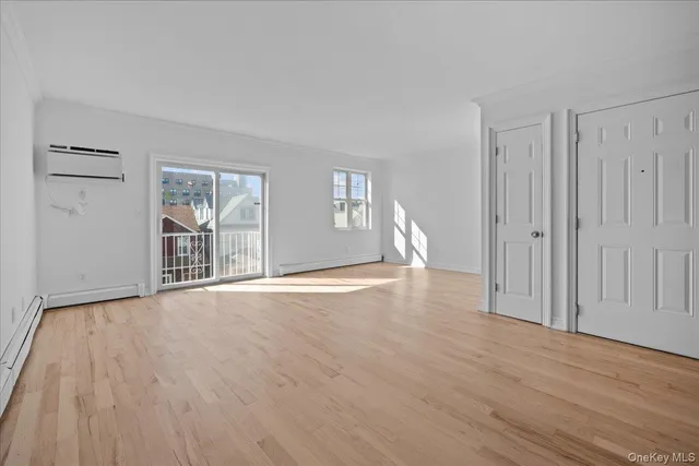 a kitchen with stainless steel appliances granite countertop a refrigerator a sink and wooden cabinets