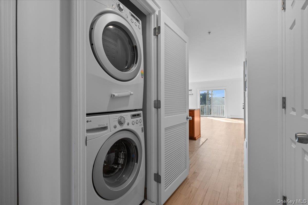 126 Beach 92nd Street, Unit 3C Queens, NY 11693 - Photo 4 of 16 a utility room with dryer and washer