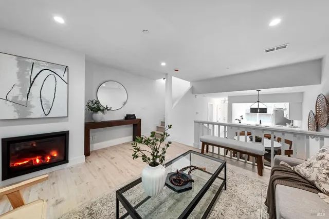 a living room with furniture a fireplace and a fireplace