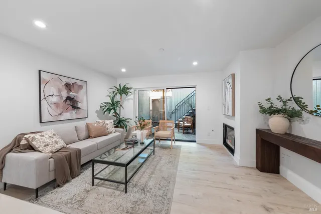 a living room with furniture flowerpot and window