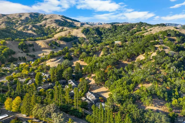 a kitchen with a stove and a refrigerator