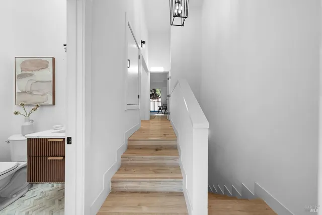 a view of a hallway view with staircase