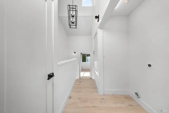 a bathroom with a toilet a sink and a mirror