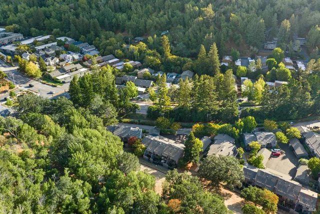 a wooden bench sitting in front of a house