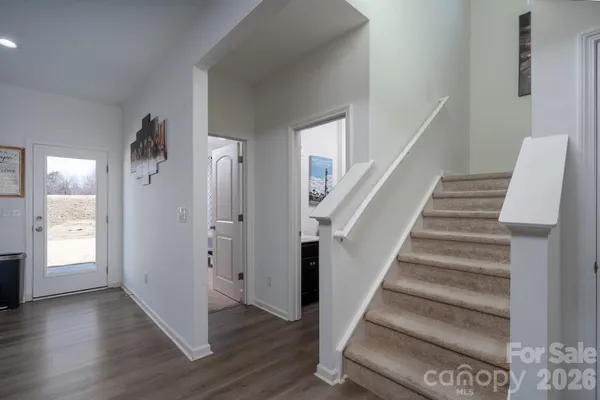 a view of an entryway with wooden floor