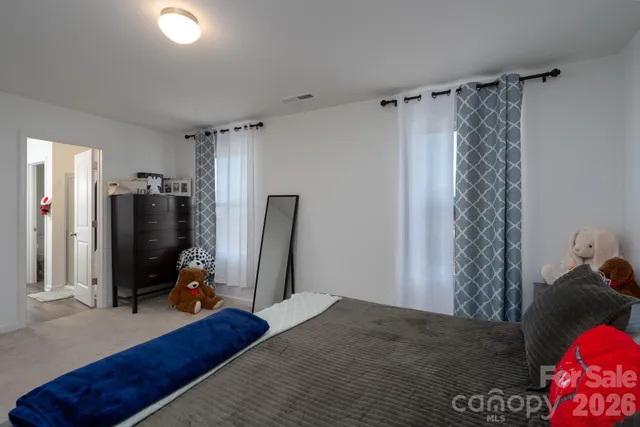 a view of a livingroom with closet and workspace