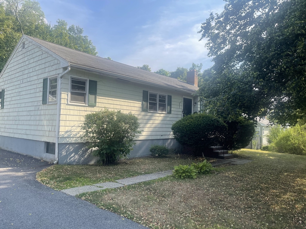 5 Brookfield Road Andover, MA 01810 - Photo 1 of 17 a view of a house with a yard and a garden