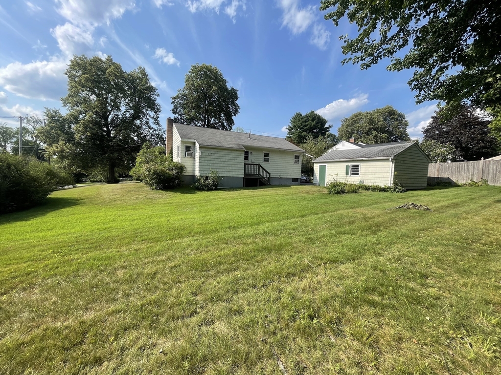 5 Brookfield Road Andover, MA 01810 - Photo 4 of 17 a view of a house with a yard and garage